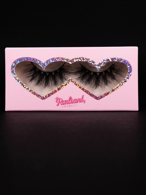 Pink box with false eyelashes featuring the brand 'Radiant' on a black background